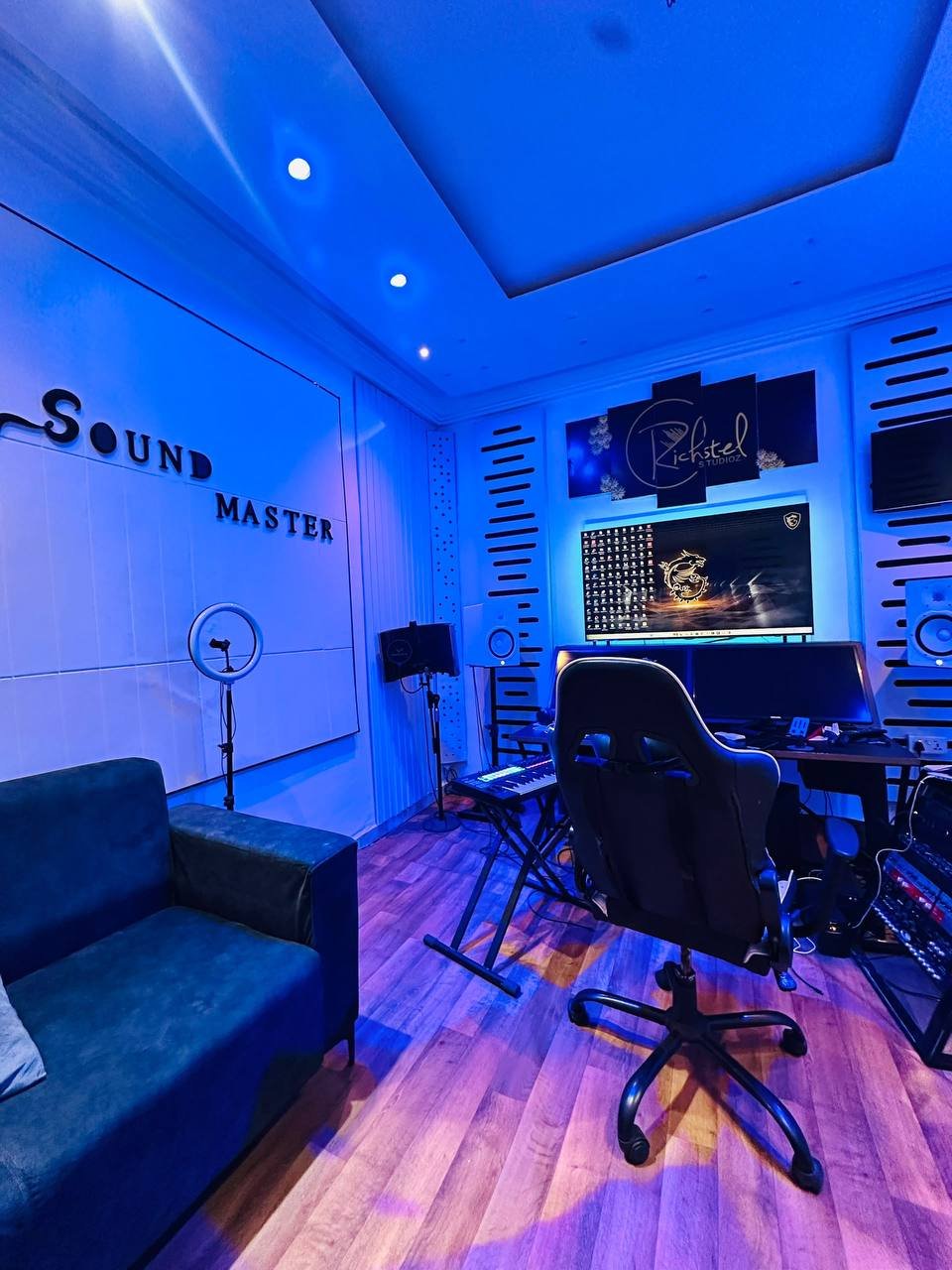 Blue-lit Qholabeatz studio control room