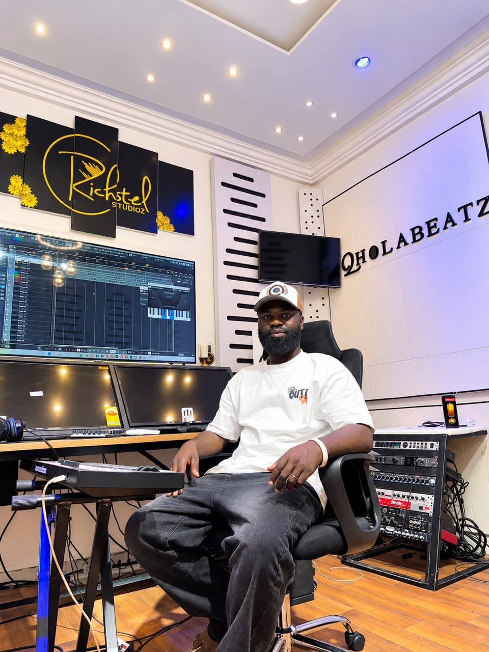Qholabeatz producer seated in the studio